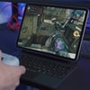 playing first-person shooter game on a laptop