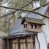 a bird house outside the house